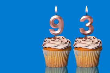 Birthday Cupcakes With Candles Lit Forming The Number 93.