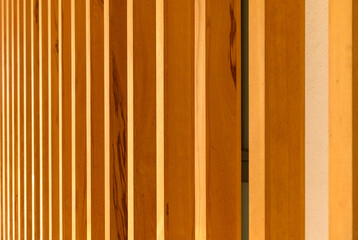 Naklejka premium Elegant background of wooden planks on the wall of a residential building 2