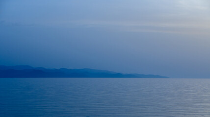 Obraz premium sea ​​view and burning in cyprus after sunset blue hour