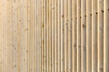 Elegant background of wooden planks on the wall of a residential building 1
