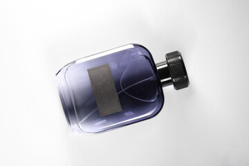 Luxury men`s perfume in bottle on white background, top view