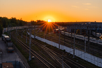 A red sunset over the railway tracks. Urbanism and infrastructure