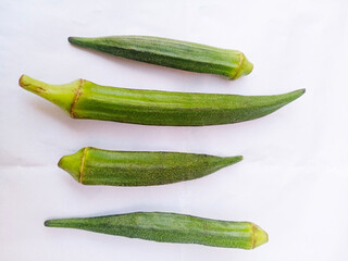 Lady finger vegetable. Natural fresh organic 4 pieces of lady finger or okra okro isolated on white...