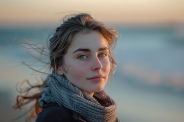 Fototapeta premium Woman Looking Serious at the Beach: Candid Moment of Thoughtfulness by the Ocean