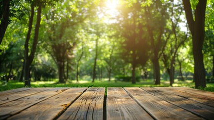 Empty wooden table with green park nature background