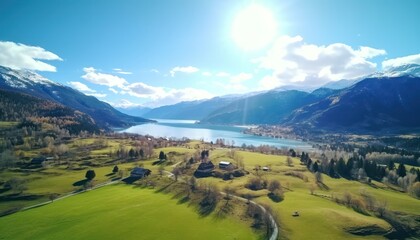 Obraz premium Stunning spring views of the countryside and green grass and beautiful flowers, with rolling hills and fertile soil, against a backdrop of vast mountains