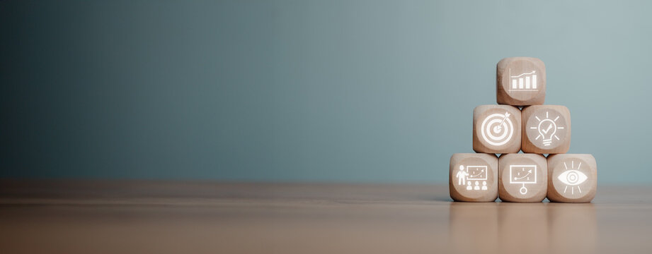 Personal growth concept, Wooden block on desk with develop, goals, creativity, training, planning and vision icon on virtual screen.