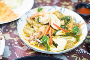 Squid, shrimp and fish stir fried with Thai kaffir lime and peppers. Thai seafood
