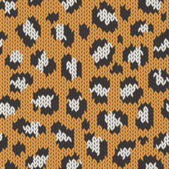 Knitted animal skin seamless pattern. Fabric imitation vector background. Flat style knit wallpaper with leopard print. Cute design for gift wrap, paper, textile