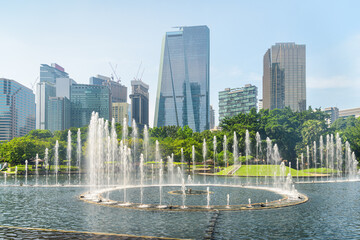 Scenic fountains in a green urban park of Kuala Lumpur