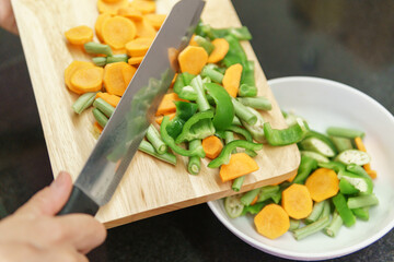 Colorful view of pieces of vegetables on a cutting board