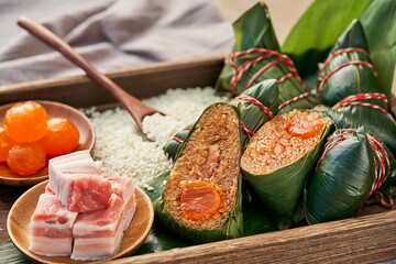 zongzi, rice dumplings,Made with glutinous rice and meat or egg yolk(Dates and Red Beans), wrapped...