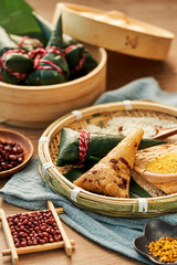 zongzi, rice dumplings,Made with glutinous rice and meat or egg yolk(Dates and Red Beans), wrapped in zong leaves, a common food for the Dragon Boat Festival in Asian countries.