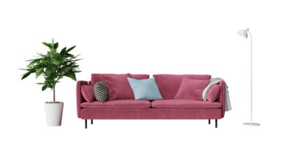 a pink couch with pillows and a plant