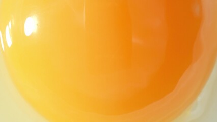 Mesmerizing macro, the camera delves into the vibrant world of a fresh yolk. Every golden hue and...