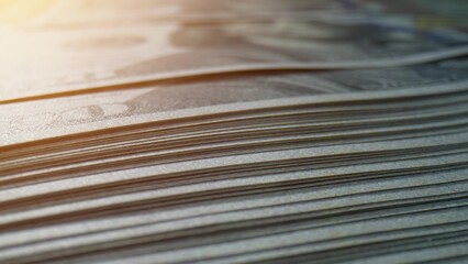 A macro view of a stack of American 100 dollar bills, rich in detail and texture. Climate finance concept. Paper money Background.   
