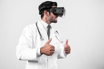 Caucasian smart doctor wearing VR goggles and lab coat while explaining medical theory....