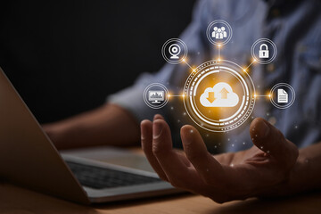 Yellow Cloud Storage Network or Cloud Computing Technology Concept. Cloud,Graph,Lock,Document and HUD Icon on Business's Hand with Laptop Computer
