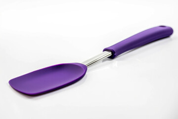 A durable purple silicone spatula with a stainless steel handle, ideal for cooking
