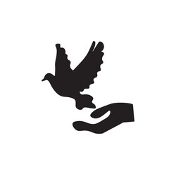 Hand and dove flying away freedom sign