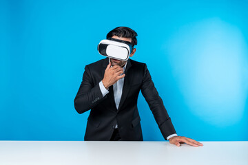 Business man planning financial plan while using VR goggle. Professional project manager looking...