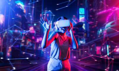 Female standing in virtual reality cyberpunk style building wear VR headset connecting metaverse,...