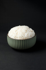 Thai Jasmine Rice in Ceramic Bowl, staple food of Thailand and Asia, provides energy in every meal.