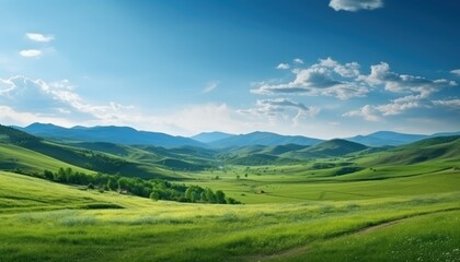 A stunning spring day landscaping views of fertile land surrounded beautiful green vegetation, wide stretches of hills and mountains with clear skies in spring