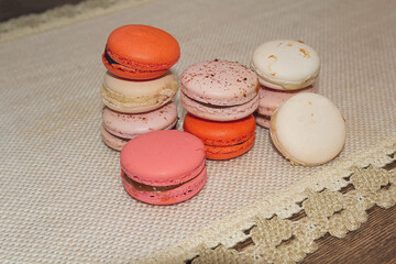 Pastel macaron on textile retro background. Sweets dessert