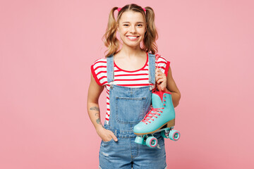Young happy cheerful woman wear red t-shirt denim overalls casual clothes hold rollers look camera...