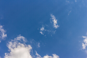 Landscape with blue sky and altocumulus white clouds beautiful blue sky background. Beauty clear cloudy in sunlight calm bright winter or summer windy air background.