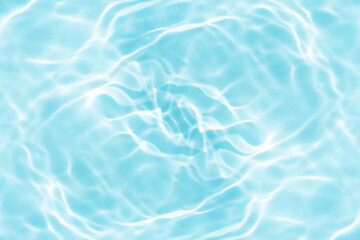 Blue water with ripples on the surface. Defocus blurred transparent blue colored clear calm water surface texture with splashes and bubbles. Water waves with shining pattern texture background.