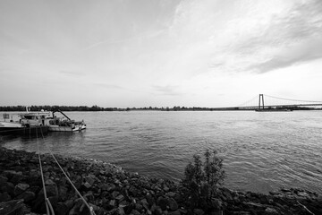 View of the Rhine bridge near Emmerich am Rhein. Landscape by the river in the evening with a suspension bridge on the Lower Rhine.
