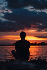 Peaceful silhouette of a millennial watching the horizon.