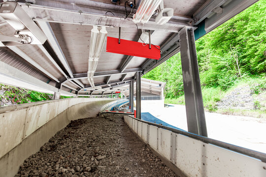 destructed of bobsledding Sch&ouml;nau am K&ouml;nigssee. Berchtesgadener Land, Alps, Germany. scree and debris. Destruction by Rain and storm. since 2021: out of service.  