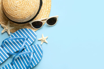 Top view of flip flops,sunglasses,starfish and straw hat with copy space for text. Summer holiday concept