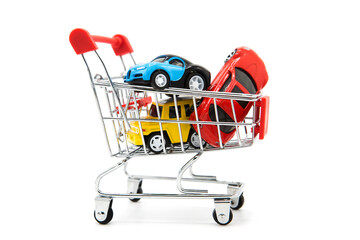 Car shopping. Supermarket shopping cart with a set of various luxury cars isolated on white...