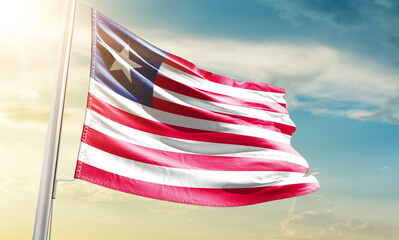 Liberia national flag waving in beautiful sky.