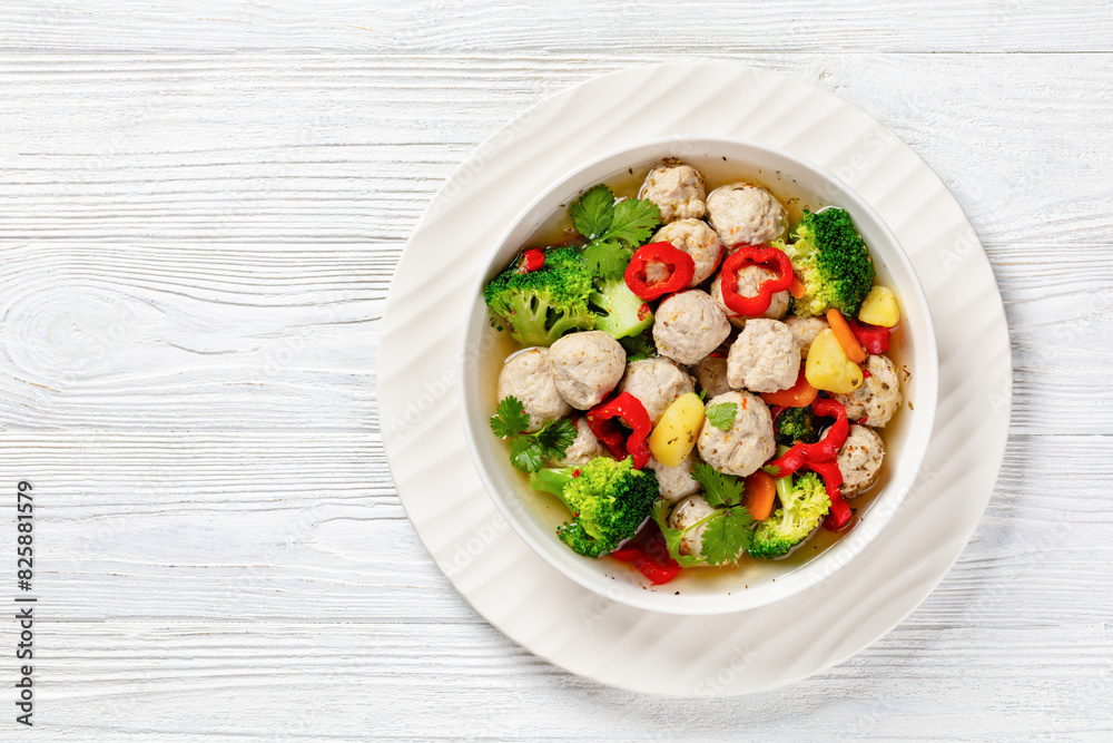 Wall mural chicken meatball soup with vegetables in a bowl