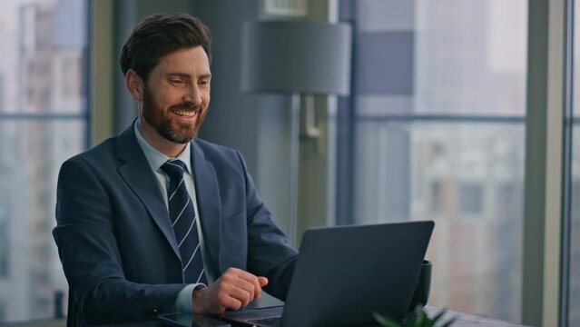 Happy man corresponding client computer at office closeup. Guy drinking coffee