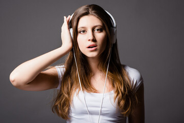 Studio portrait, woman and headphones for music with hip hop audio, radio app and online playlist....