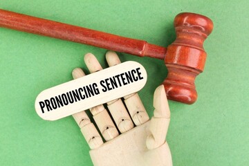judge's hammer and Dr. stick with the word pronouncing sentence. court concept