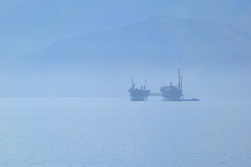 marine oil extraction platform in the morning fog - Prinos oil area, near Thassos, Greece, Aegean sea