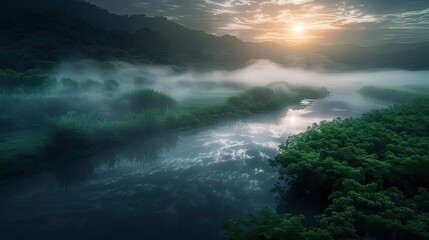 Obraz premium Serene misty river landscape at sunrise with lush greenery, calm water, and mountain in the background, creating a peaceful and ethereal atmosphere.