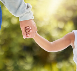 Parent, child and holding hands in outdoor closeup for walking park, support and trust with care for enjoy nature sunshine. Family, relax and bonding in garden on vacation together on summer morning