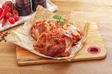 Marinated chicken leg in tomato sauce