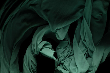 Green Organza fabric flying in curve shape, Piece of textile Green Organza fabric throw fall in...