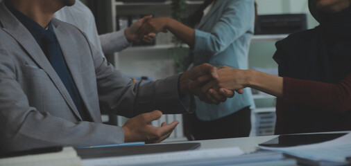 Business people shaking hands after meeting. colleagues handshaking after conference. Greeting deal, teamwork partnership cooperate concept.