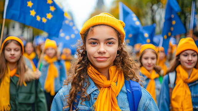 Young woman with a group holding eu flags during europe day festivities