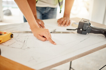 Architecture, hands and planning with blueprint on table for creativity, building design and...